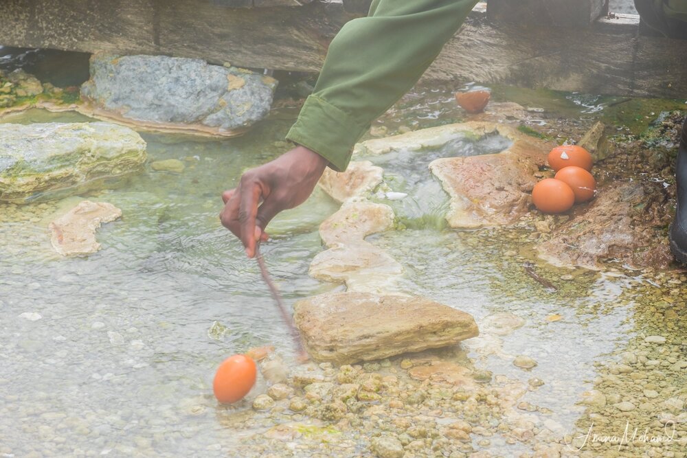 Harriet our guide boiling eggs in the hot springs at Semiliki, Uganda @2018 Amina Mohamed Photography
